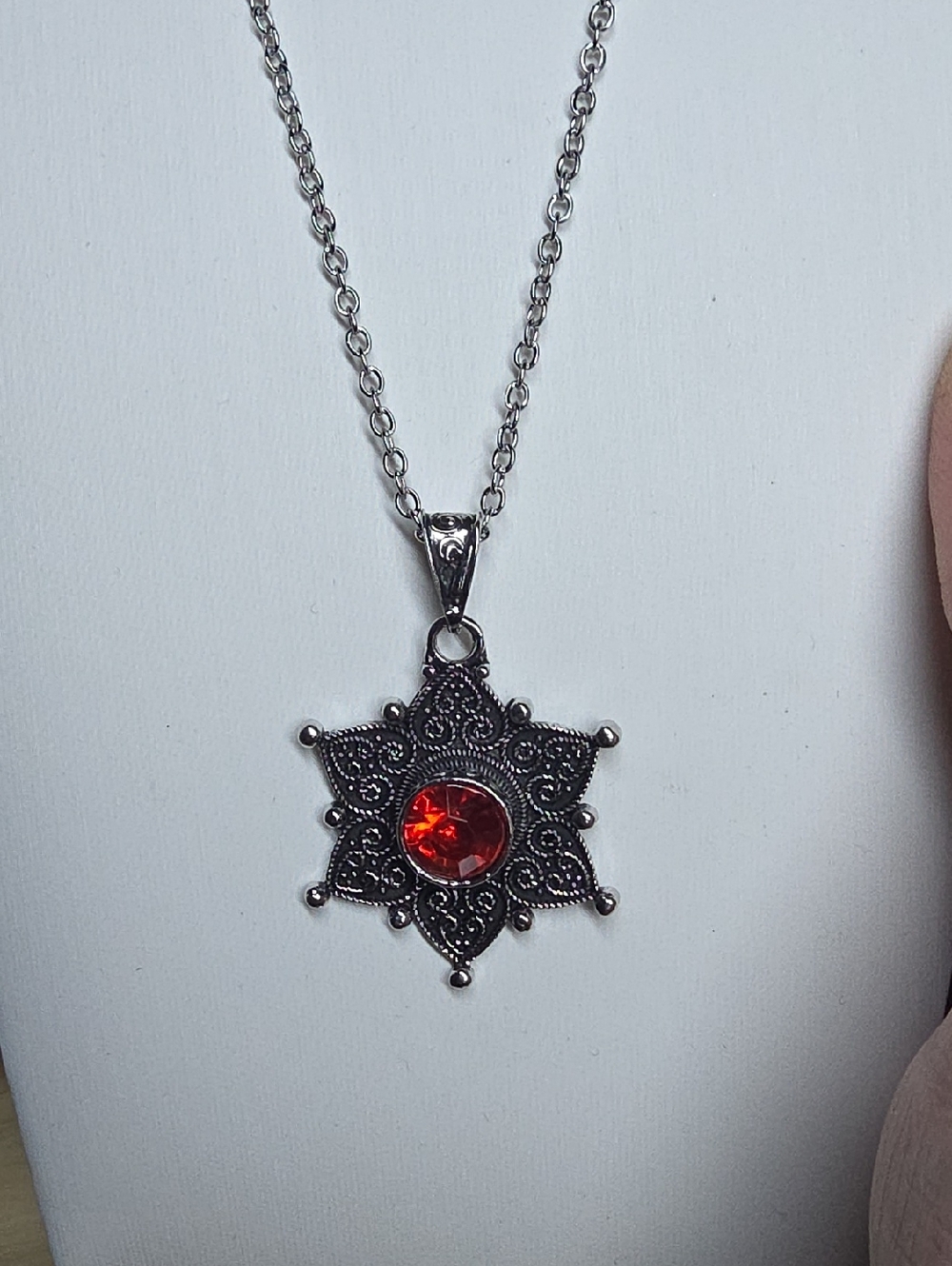 Silver Tone Starburst Pendant Necklace with Red Gem
